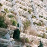 The Alterlaa complex in Vienna, Austria is a good example of architecture incorporating urban rewilding by giving each apartment a large balcony with a 4 m2 (43 sq ft) trough planter in front of it.
