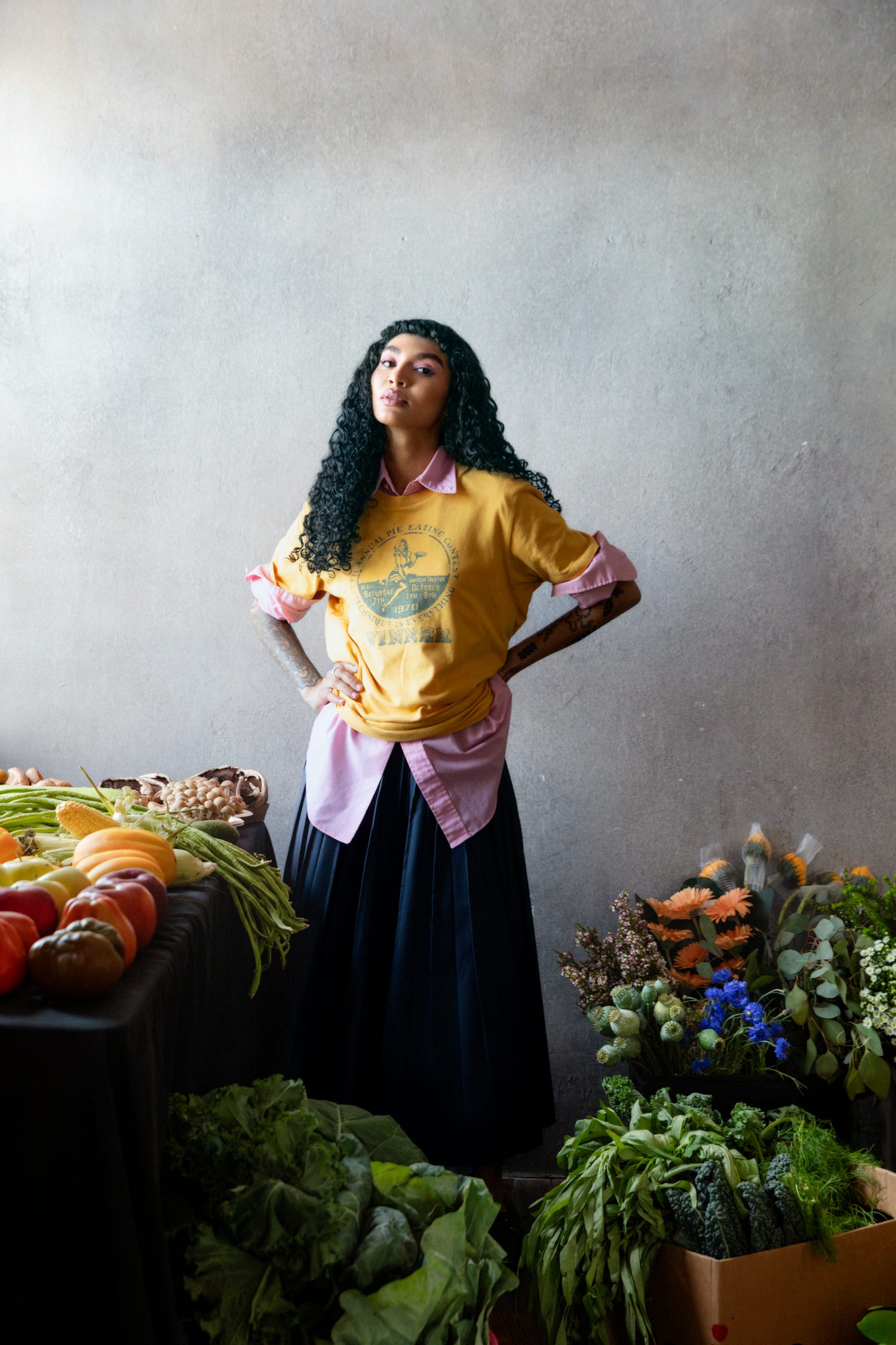Roe on a grey background surrounded by loads of vegetables